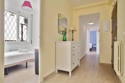 a bedroom with a white dresser and a mirror at Stay U-nique Apartments Marina III in Barcelona