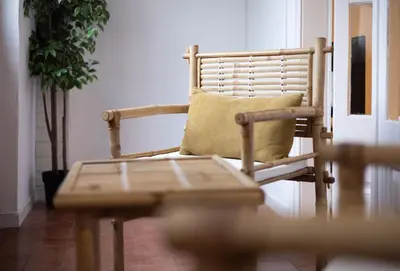 a chair with a pillow sitting in a room at Stay U-nique Apartments Granados in Barcelona
