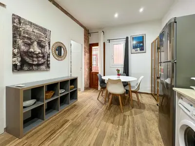 a kitchen and dining room with a table and chairs at Stay U-nique Apartments Caminal in Barcelona