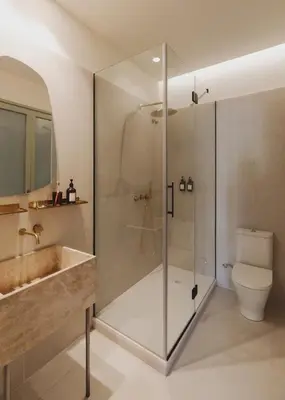 a bathroom with a shower and a sink and a toilet at Casa Llimona Hotel Boutique in Barcelona