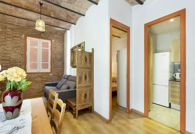 a living room with a couch and a table at Great apartment in Sagrada Familia with Balcony in Barcelona