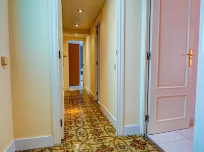 an empty hallway with a tile floor at Sea and Sand Penthouse by Hello Homes Sitges in Sitges