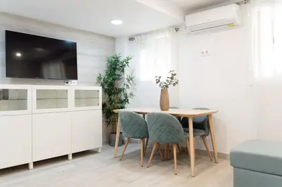 a dining room with a table and chairs at Refugio playero para 5 personas in Castelldefels