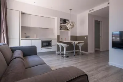 a living room with a couch and a table at Habitat Apartments ADN in Barcelona