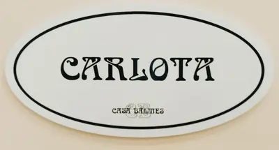 a black and white frisbee with the word carolina at Casa Balmes in Barcelona