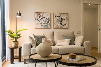 a living room with a couch and a table at CATERINA Editorial in Barcelona