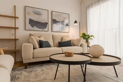 a living room with a couch and a table at CATERINA Editorial in Barcelona