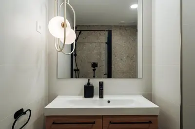 a bathroom with a white sink and a mirror at CATERINA Liceu in Barcelona