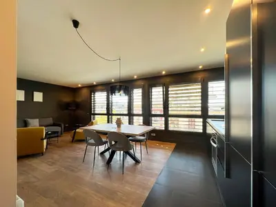 a kitchen and dining room with a table and chairs at Stay U-nique Apartments Pau Claris II in Barcelona