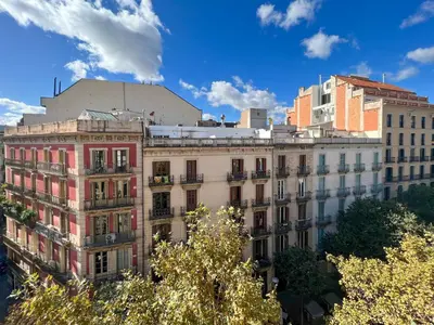 a large building in a city with buildings at Stay U-nique Apartments Pau Claris II in Barcelona