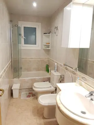 a bathroom with a toilet and a sink and a shower at Room in shared appartment close to Camp Nou in Hospitalet de Llobregat