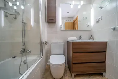 a bathroom with a toilet and a shower and a sink at HomeHolidaysRentals Bluemar-Costa Barcelona in Pineda de Mar