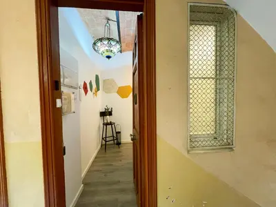 a hallway with a door leading to a room at Boutique Lepant in Barcelona