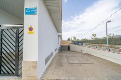 a building with a gate on the side of it at HomeHolidaysRentals Noelani- Costa Barcelona in Pineda de Mar