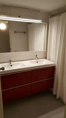 a bathroom with a sink and a large mirror at Apart 2 beds 1 sofabed downtown 31 nigths min Barcelona in Barcelona