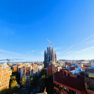 a view of a city with a cathedral in the background at G74 AVENIDA GAUDI nice 4 bedrooms apartment with balcony with views of the Basilica Sagrada Familia in Barcelona