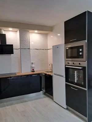 a kitchen with stainless steel appliances and a counter at MERIDIANA sant andreu 4 bedrooms in Barcelona