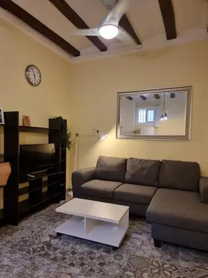 a living room with a couch and a coffee table at 2 bedrm BCN down AC WIFI 30 nigths min in Barcelona