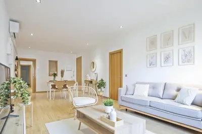 a living room with a couch and a table at Ola Living Consell De Cent in Barcelona