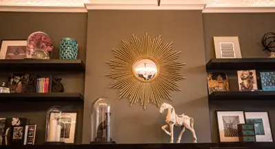 a room with a clock and a horse on a shelf at Way to BCN Casa Rovira in Barcelona