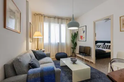 a living room with a couch and a table at Housalia Gracia 2 in Barcelona