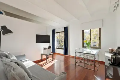 a living room with a couch and a table at Enjoy Apartments Urban Retreat Valencia 2 in Barcelona