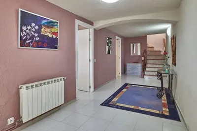 a hallway with a room with pink walls at Villa Soledad en Olivella, Sitges, Barcelona in Olivella