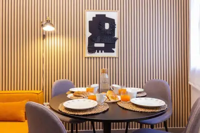 a table with a plate of food on it at Duplex with terrace near Bcn in Terrassa