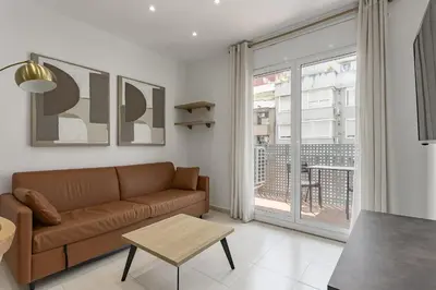 a living room with a couch and a window at Ola Living Sagrada Familia in Barcelona