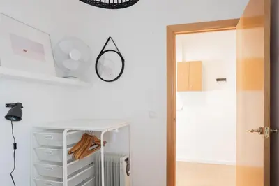 a room with a mirror and a closet at Housalia Lepant 3 bedroom apartment 300 meters de Sagrada Familia in Barcelona