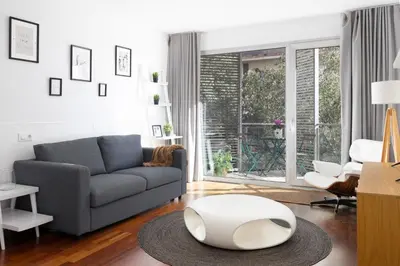 a living room with a couch and a table at Marion House Barcelona in Barcelona
