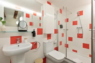 a bathroom with a toilet and a sink and a shower at Ola Living MACBA in Barcelona