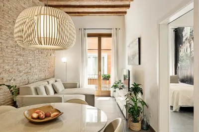 a living room with a table and a couch at Ola Living MACBA in Barcelona