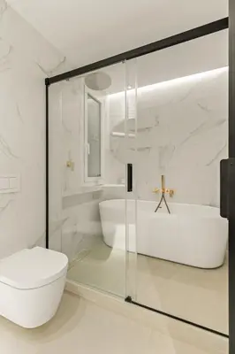 a white bathroom with a toilet and a sink at Modern & stylish apartment in Barcelona in Barcelona