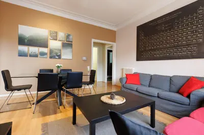 a living room with a couch and a table at Elegance and Comfort in Barcelona, 4Bedroom Apartment in the Most Exclusive Area in Barcelona