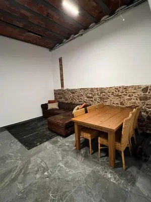a living room with a wooden table and a couch at Beautiful Appartment in Martorell (Barcelona) in Martorell