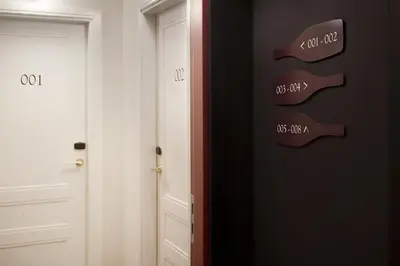 a room with two doors and a sign that reads no exit at Praktik Vinoteca in Barcelona