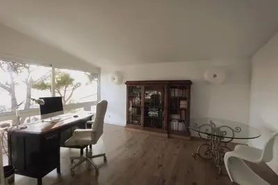 an office with a desk with a computer and a table at Casa Can Bellavista Barcelona town house in Premia de Dalt