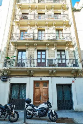 two motorcycles parked in front of a building at Catalan Comfort near Sagrada Familia by MyRentalHost in Barcelona