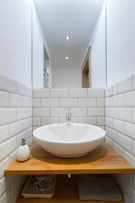 a bathroom with a white sink and a mirror at Stay Barcelona Charming Gracia in Barcelona