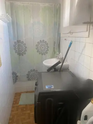 a printer in a bathroom with a sink and a shower at Cozy apartament in Barcelona