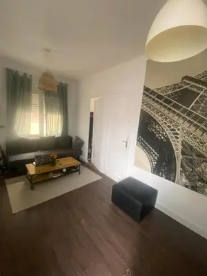 a living room with a couch and a table at Cozy apartament in Barcelona