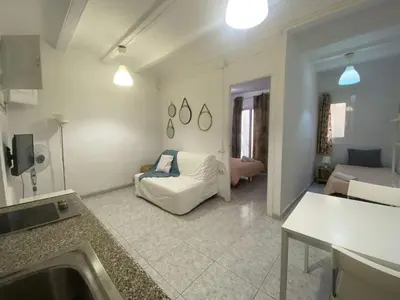 a living room with a couch and a bed in it at 017 New of love 3 1 in Barcelona