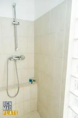 a bathroom with a shower with a shower head at Bcn - Poble Nou in Barcelona