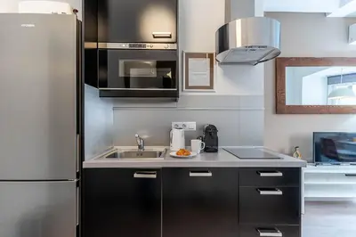 a room with two bunk beds and a hallway at 4212 - AB Poble Sec in Barcelona
