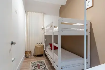 a living room with a table and chairs and a couch at 4212 - AB Poble Sec in Barcelona