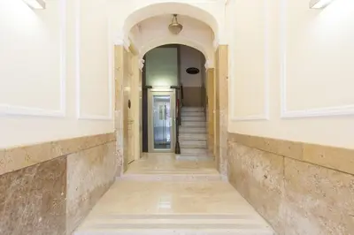 a hallway with a staircase in a building at Click&Flat Seneca Suites in Barcelona