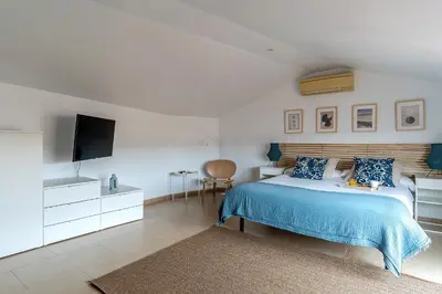 a bedroom with a bed and a flat screen tv at AB Besòs River Apartment in Sant Adria de Besos