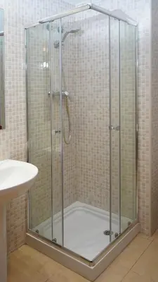 a shower with a glass door in a bathroom at MarBarcelona Suites Berlin in Barcelona