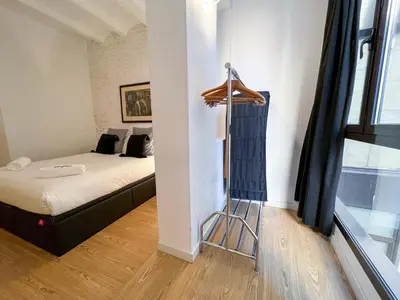 a room with a bed and a ladder in it at Stay U-nique Apartment Arago II in Barcelona